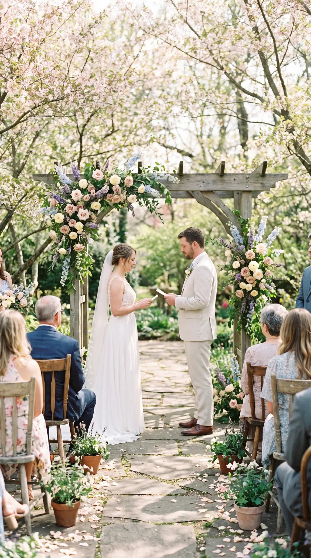 25 Seasonal Real Wedding Inspiration for Every Kind of Celebration 2 Spring Garden Ceremony With Soft Pastel Florals: A spring garden wedding feels fresh and romantic when flowering trees, soft greenery, and pastel blooms frame the ceremony naturally. Layers of blush, lavender, pale blue, buttercream, and fresh green create gentle visual depth without making the setting feel overly formal. ...